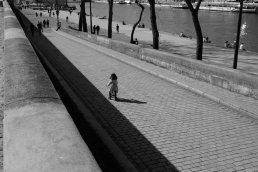 Black and white iconic photography street small girl biking Paris