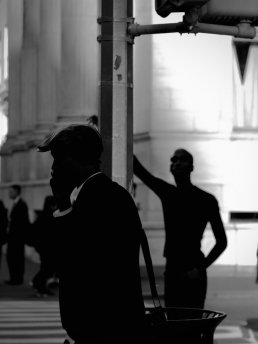Black and white photography men shadow New York street
