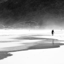 Black and white surfer on the beach Brazil