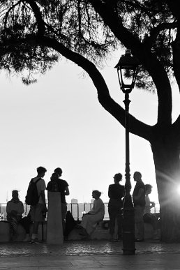 Black and white photographs people shadowy sunset Lisboa