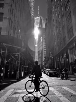 street photography bike rider Wall Street New York sunlight shadow sebastien franca